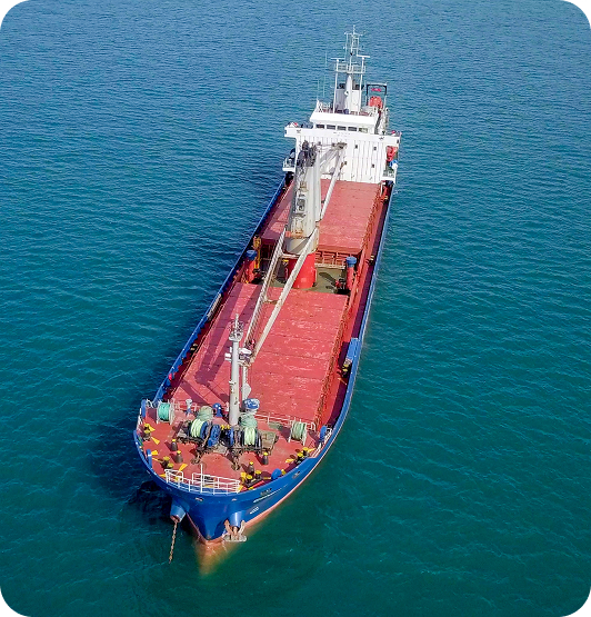 A large cargo ship navigating the ocean, representing Lofte's premium marine logistics and port services